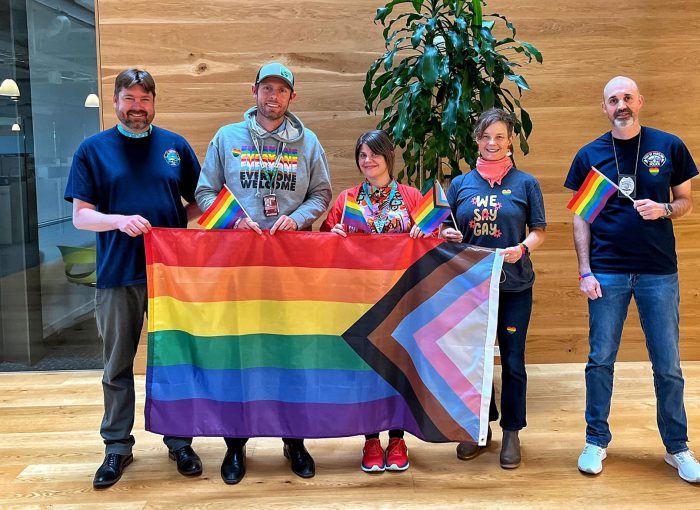 Port employees carry an inclusive Pride flag